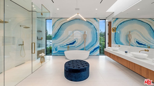 bathroom featuring separate shower and tub, a wall of windows, tile patterned floors, and vanity