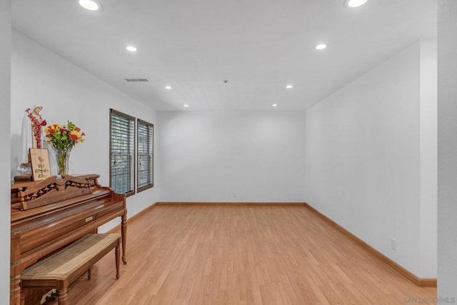 spare room with light wood-type flooring