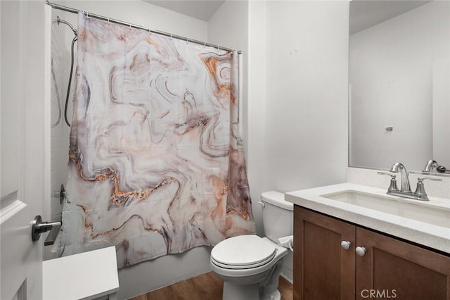 full bathroom featuring toilet, shower / bath combination with curtain, wood-type flooring, and vanity