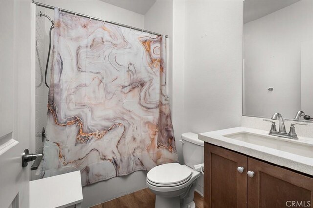 5097 Larkspur Rd, Banning, CA 92220 - full bathroom featuring vanity, wood finished floors, and shower / bath combination with curtain