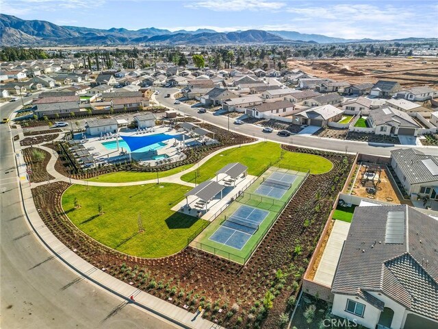 5097 Larkspur Rd, Banning, CA 92220 - aerial perspective of suburban area featuring a pool and mountains