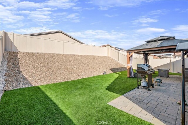 5097 Larkspur Rd, Banning, CA 92220 - fenced backyard featuring a gazebo and a patio