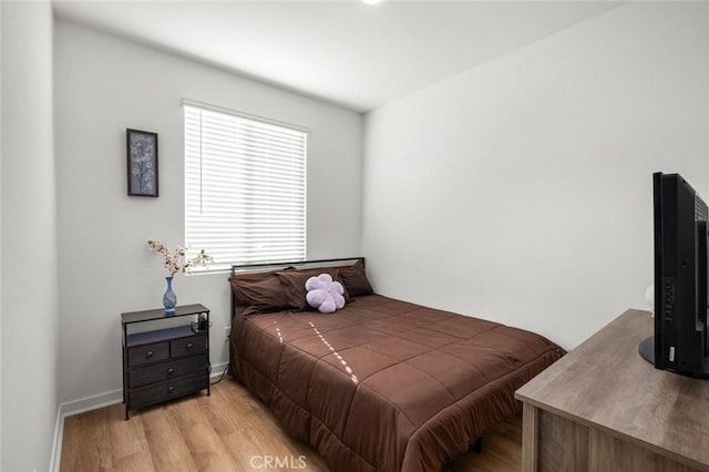 bedroom with light hardwood / wood-style floors