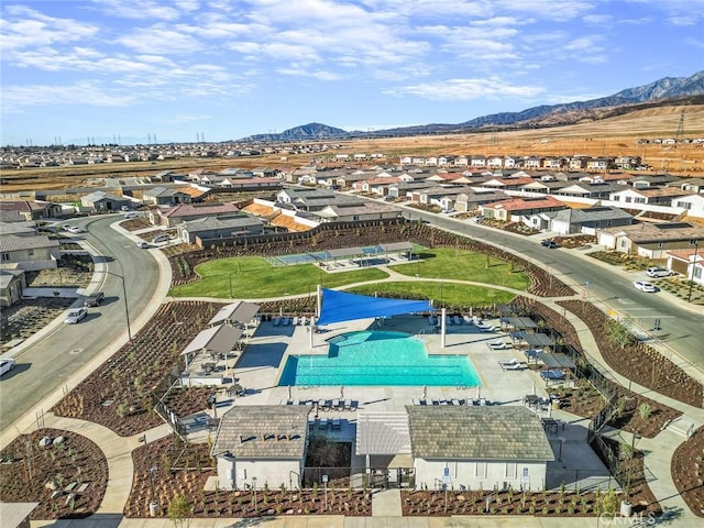 birds eye view of property featuring a mountain view