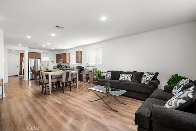 5097 Larkspur Rd, Banning, CA 92220 - living area featuring light wood-style flooring and recessed lighting