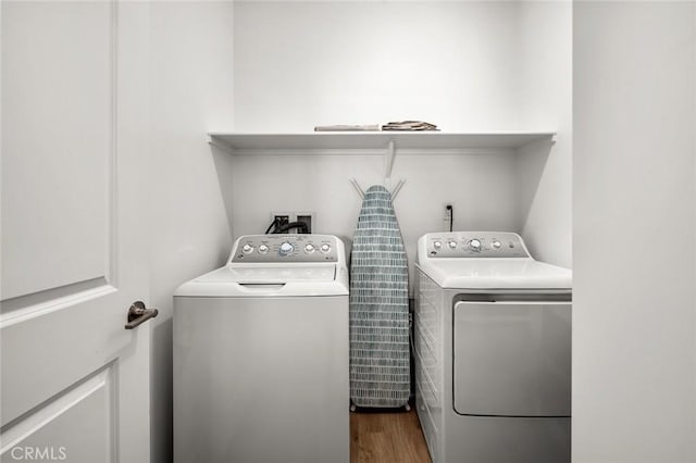 5097 Larkspur Rd, Banning, CA 92220 - laundry area with washing machine and dryer and dark wood-style flooring