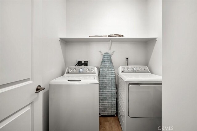 5097 Larkspur Rd, Banning, CA 92220 - laundry area with washer and clothes dryer and dark wood-style flooring
