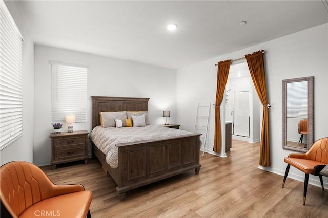 bedroom with light hardwood / wood-style floors