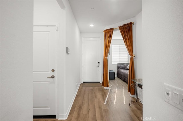 5097 Larkspur Rd, Banning, CA 92220 - hall featuring wood finished floors, baseboards, and recessed lighting