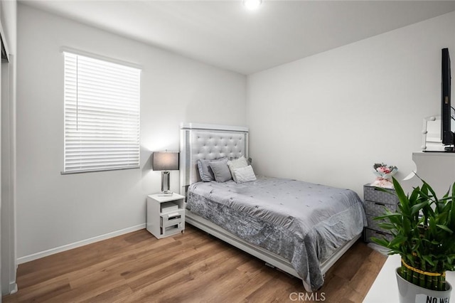5097 Larkspur Rd, Banning, CA 92220 - bedroom featuring wood finished floors and baseboards