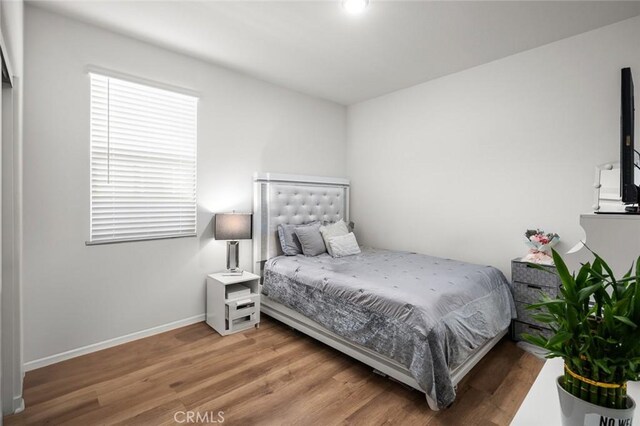5097 Larkspur Rd, Banning, CA 92220 - bedroom featuring wood finished floors and baseboards