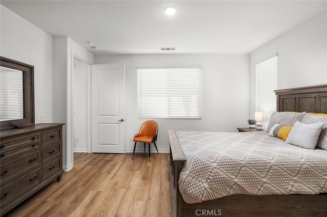 bedroom with light hardwood / wood-style floors