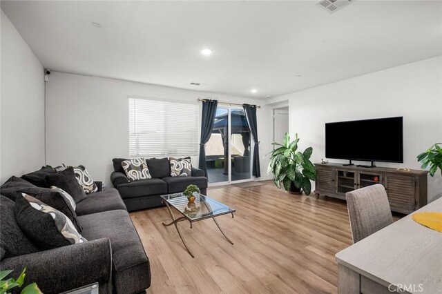 5097 Larkspur Rd, Banning, CA 92220 - living area featuring light wood-style flooring and recessed lighting
