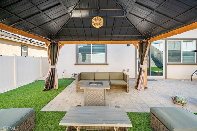 5097 Larkspur Rd, Banning, CA 92220 - view of patio / terrace featuring a gazebo and an outdoor living space with a fire pit