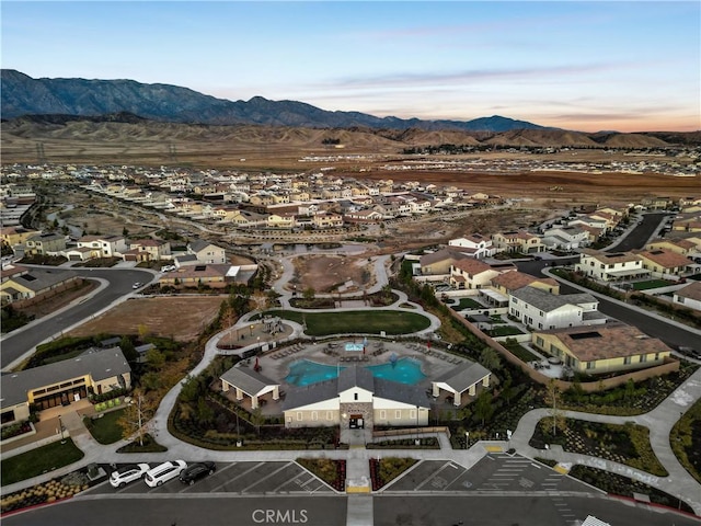 5097 Larkspur Rd, Banning, CA 92220 - aerial view of property and surrounding area featuring a mountainous background, nearby suburban area, and a pool