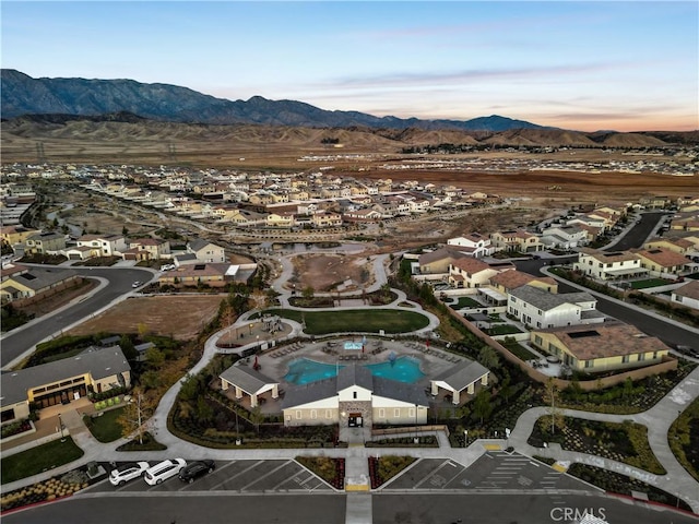 5097 Larkspur Rd, Banning, CA 92220 - aerial view of property and surrounding area featuring mountains, nearby suburban area, and a pool area