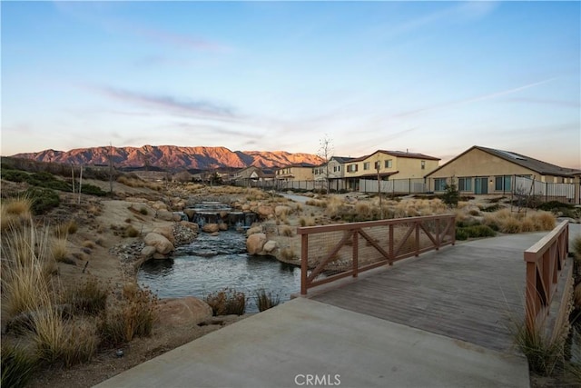 dock area featuring a water and mountain view