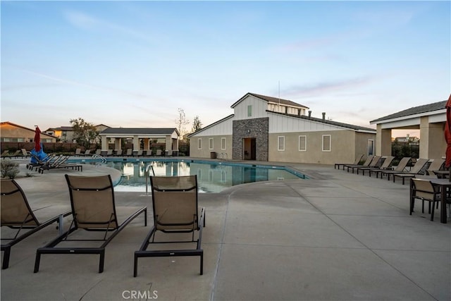 view of swimming pool featuring a patio area