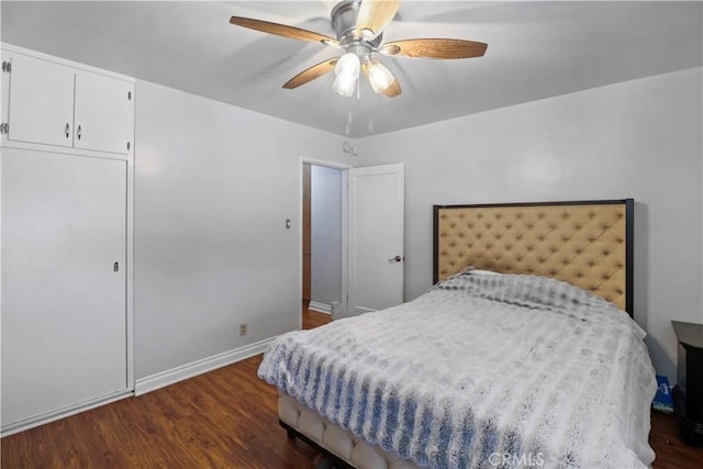 bedroom featuring ceiling fan and dark hardwood / wood-style flooring