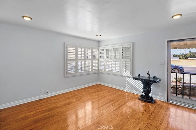 unfurnished room featuring wood-type flooring