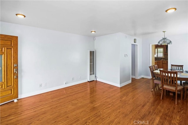 dining space featuring dark hardwood / wood-style floors