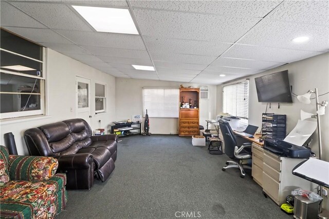 carpeted office featuring a paneled ceiling