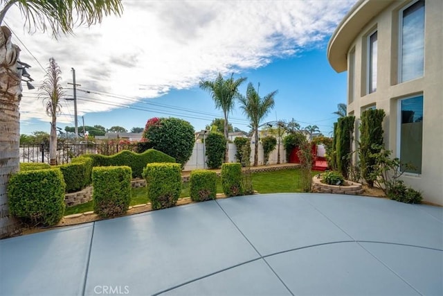 view of patio / terrace featuring fence