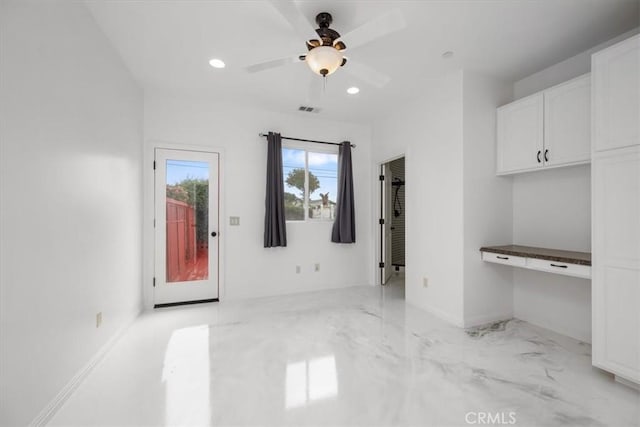 unfurnished living room with ceiling fan, built in study area, visible vents, and recessed lighting