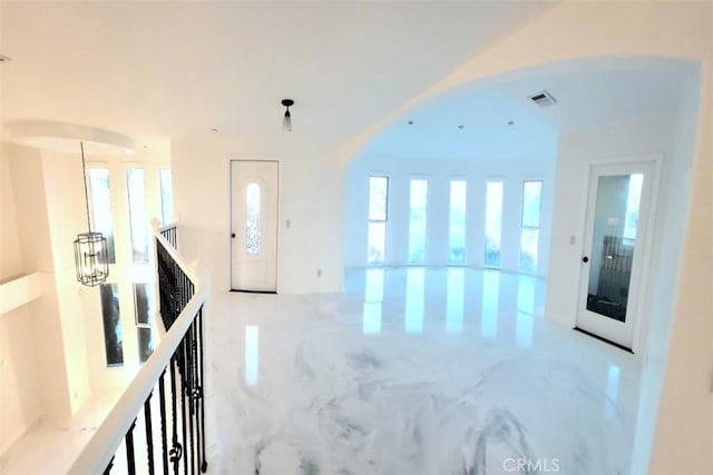 foyer with an inviting chandelier