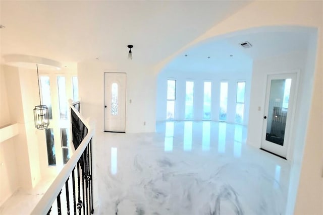 entrance foyer with marble finish floor and visible vents