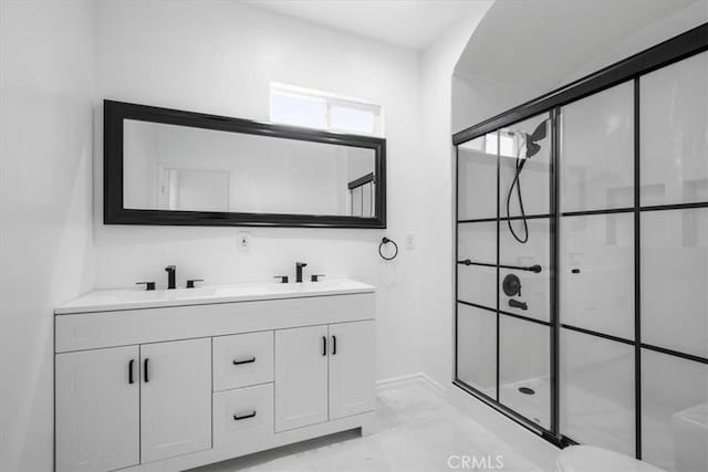 bathroom featuring vanity and walk in shower