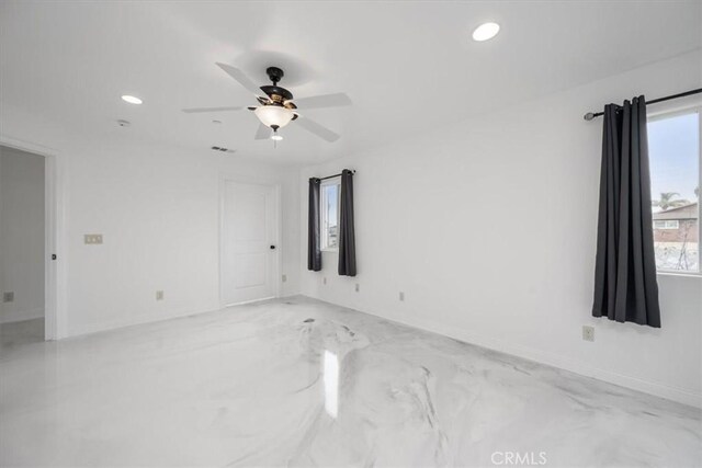 empty room featuring ceiling fan