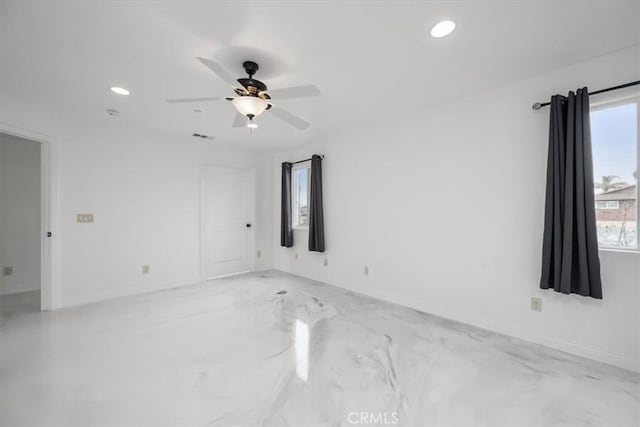 empty room featuring ceiling fan, baseboards, visible vents, and recessed lighting