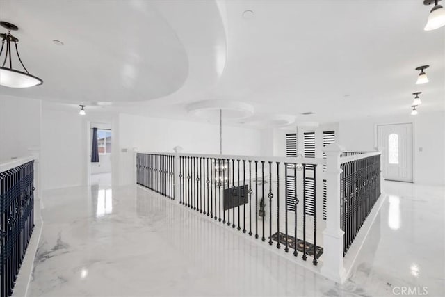 hall featuring marble finish floor