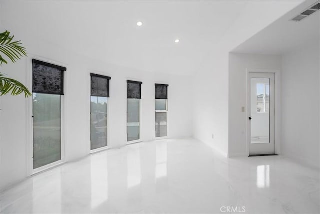 unfurnished room featuring marble finish floor, visible vents, and recessed lighting