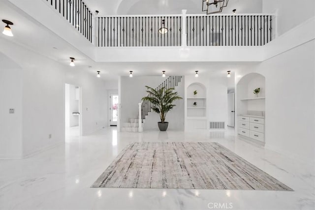 entrance foyer with a towering ceiling