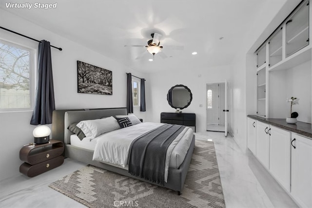 bedroom featuring marble finish floor, multiple windows, a ceiling fan, and recessed lighting