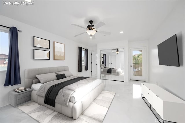 bedroom featuring ceiling fan, multiple windows, a closet, and access to exterior