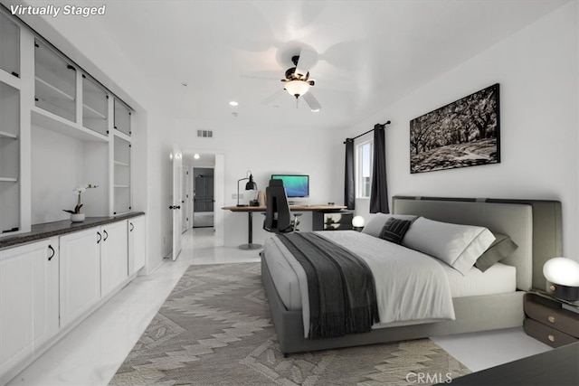 bedroom featuring marble finish floor, visible vents, and ceiling fan