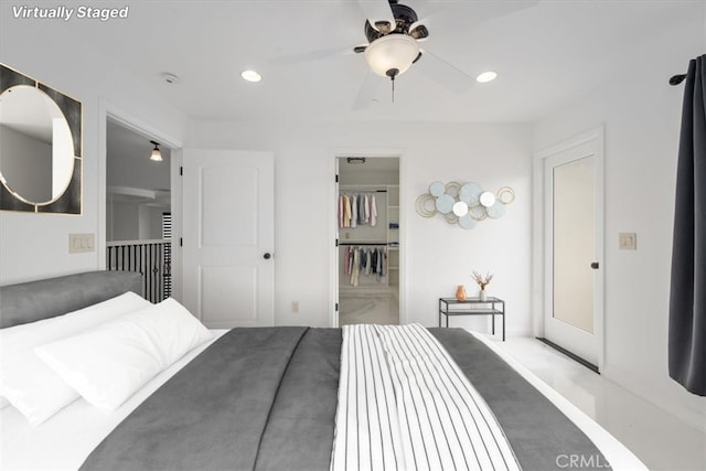 bedroom featuring ceiling fan, a spacious closet, a closet, and recessed lighting