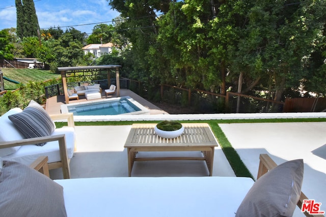 view of swimming pool featuring a patio area and outdoor lounge area