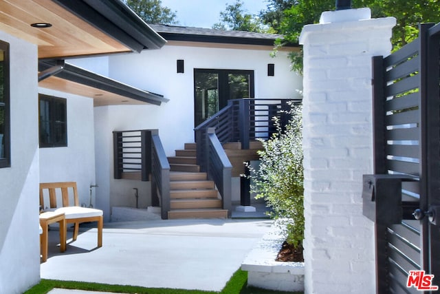 property entrance with a patio