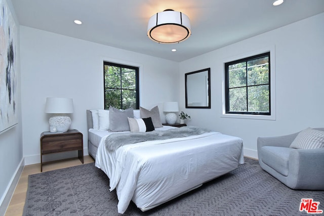 bedroom with hardwood / wood-style floors