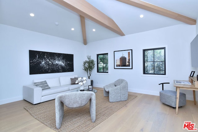 living room featuring lofted ceiling with beams and light wood-type flooring