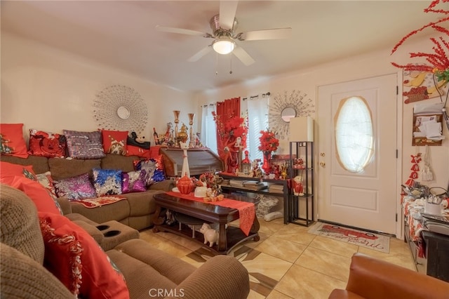 living room with ceiling fan, plenty of natural light, and light tile patterned flooring