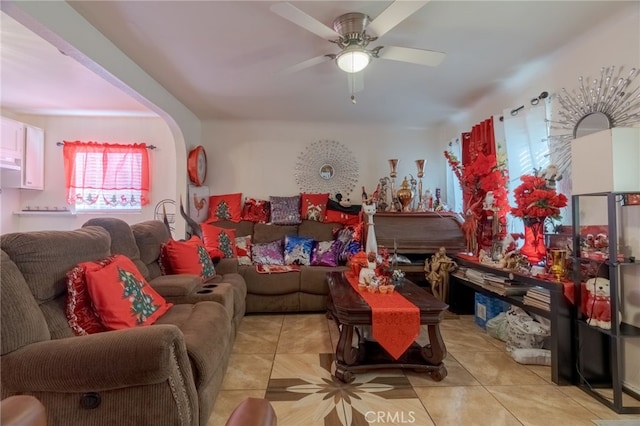 tiled living room with ceiling fan