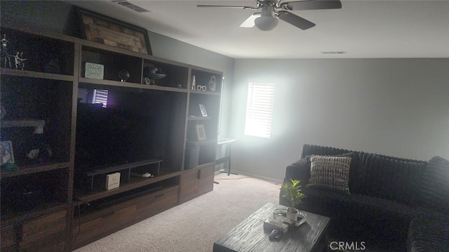 living room with ceiling fan and carpet floors