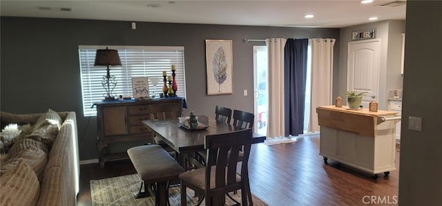 dining area with dark wood-type flooring