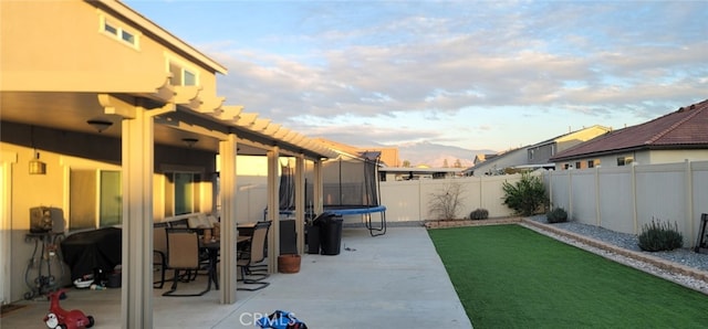 view of patio / terrace featuring a mountain view and a trampoline