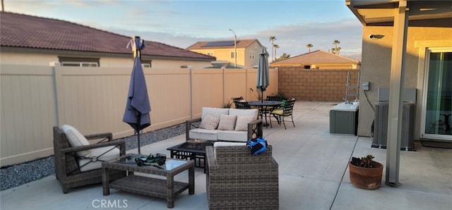 view of patio with an outdoor living space and central air condition unit